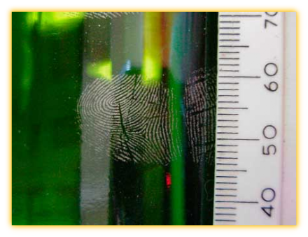 Aluminium powder dusted fingerprints on a glass bottle